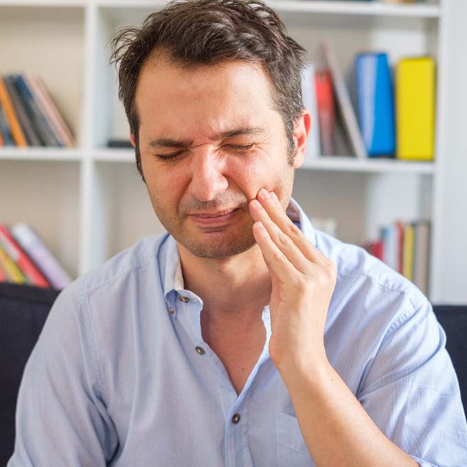 Pained man should visit his West Palm Beach emergency dentist