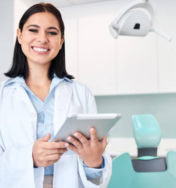 Smiling woman at beach after tooth colored filling restoration