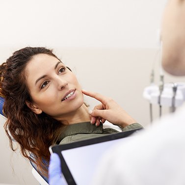 a woman speaking with her dentist