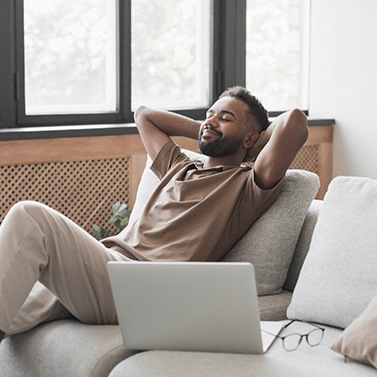 a man relaxing on his couch