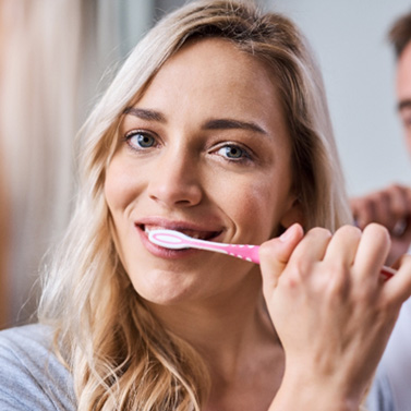 Aftercare tips for scaling and root planing include gently brushing teeth in a circular motion with a soft-bristled toothbrush