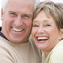Laughing older couple after T M J therapy