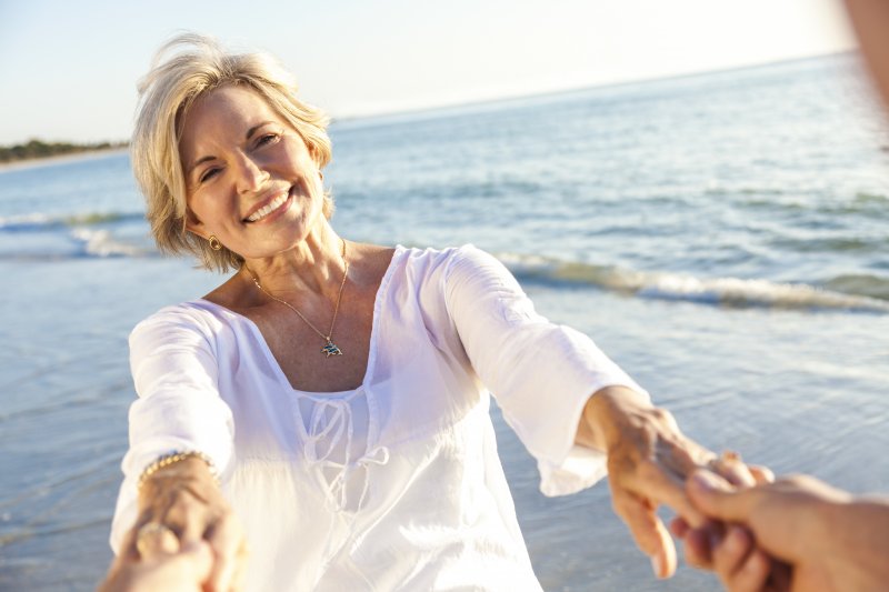 smiling person with dental implants