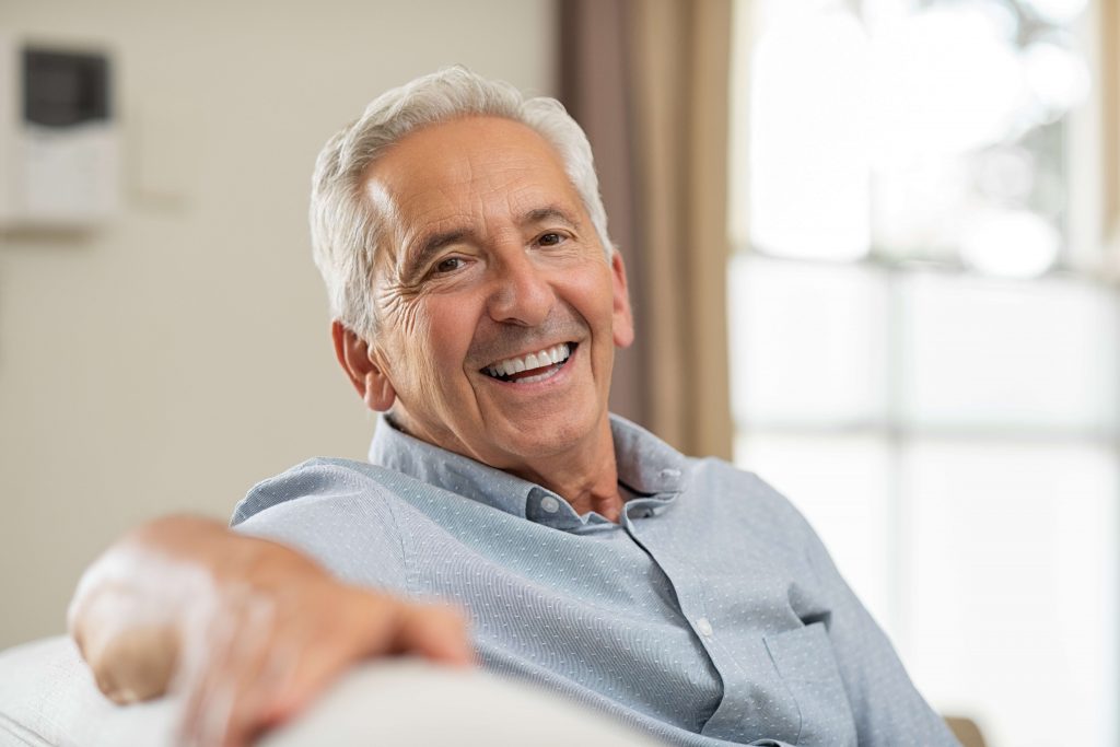 Older man smiling. 