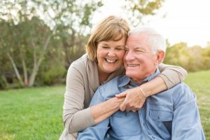 couple hugging smiling