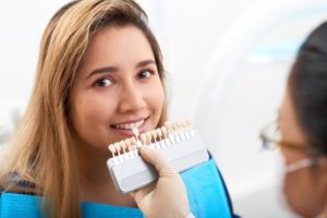 young woman getting veneer replacement in West Palm Beach