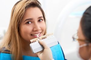 young woman getting veneer replacement in West Palm Beach 