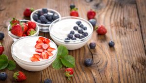 two bowls of yogurt with fruit